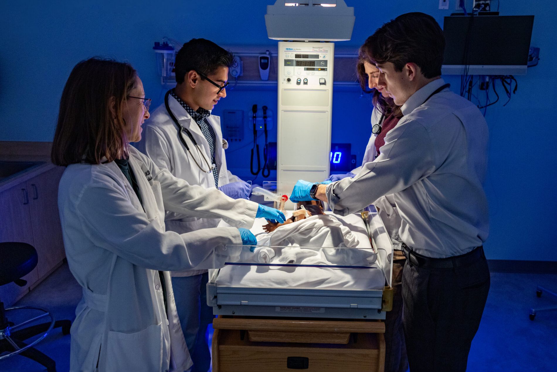 University of Georgia medical students participate in a medical simulation involving the care of an infant.